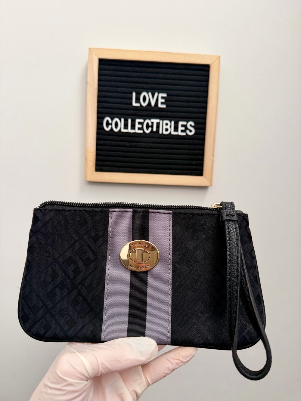 Tommy Hilfiger Black Wristlet with Gray Center Stripe and Gold Logo